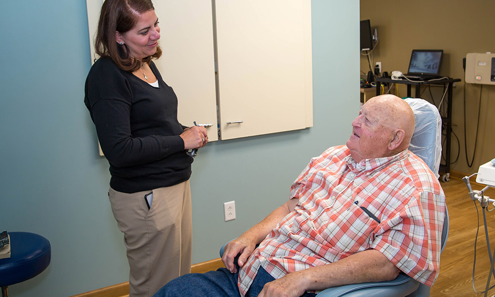 Dr. Jen talking with a patient