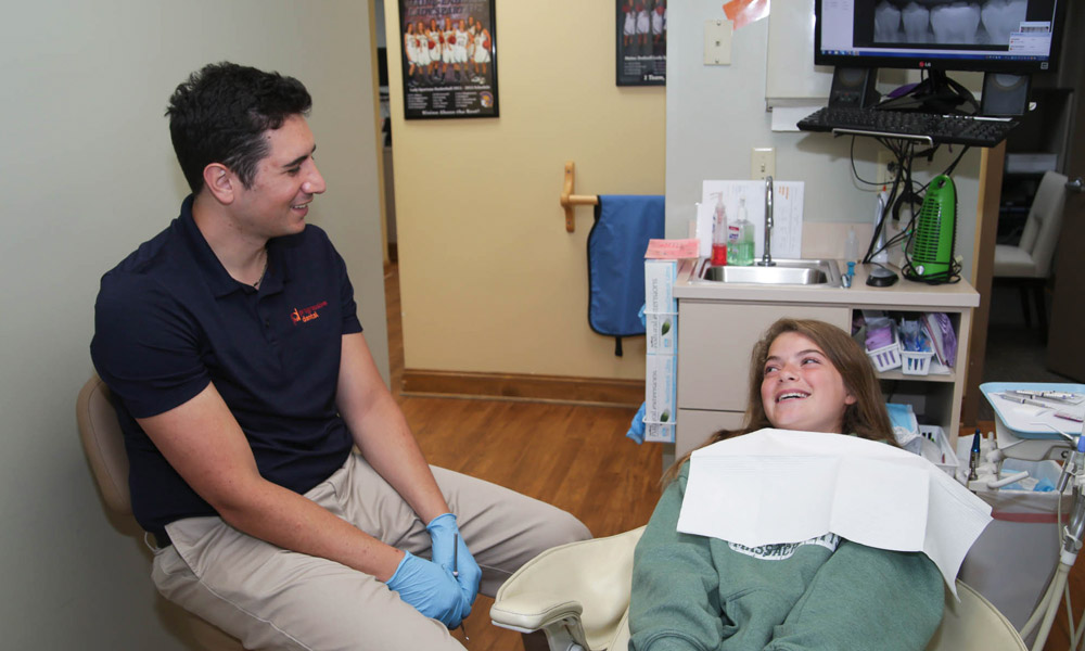 Dr.Spera with a young patient