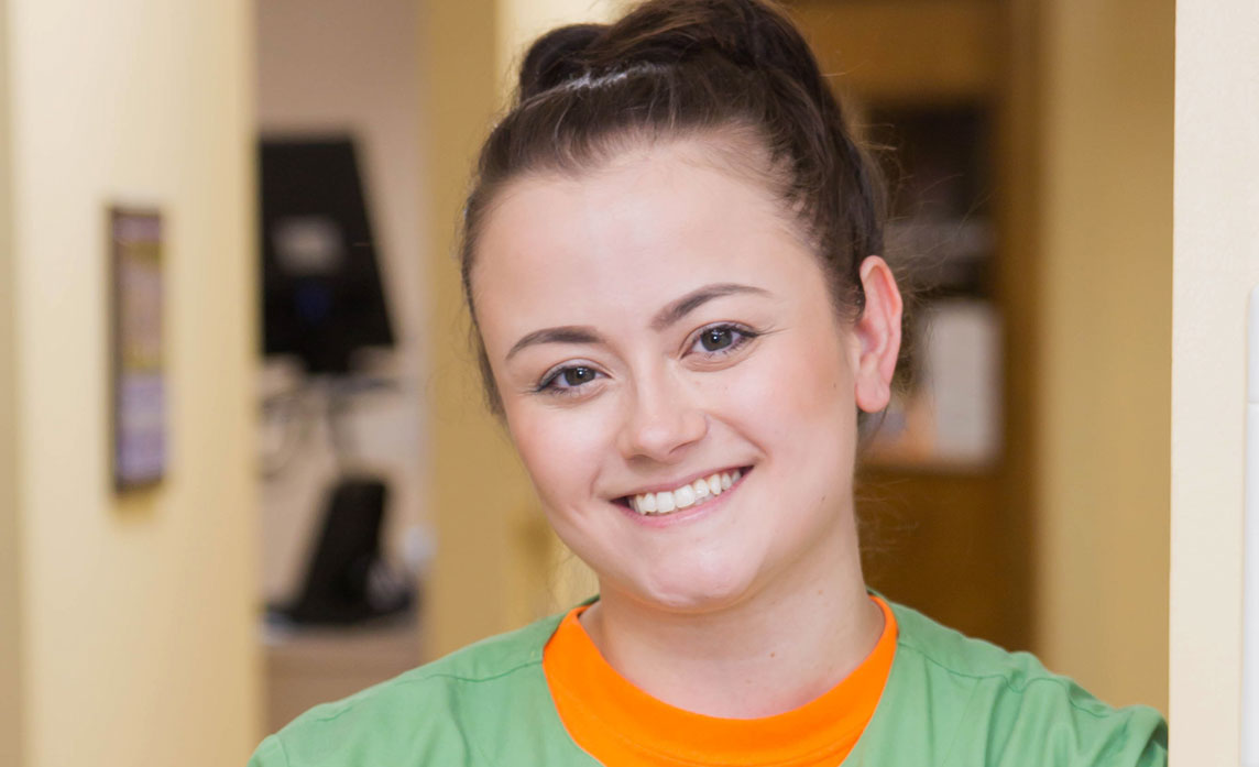 Progressive Dental staff member smiling in the hallway