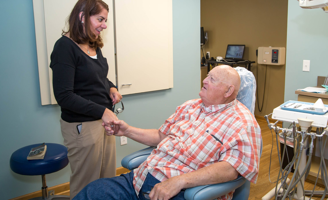 Dr. Redmore greeting a patient