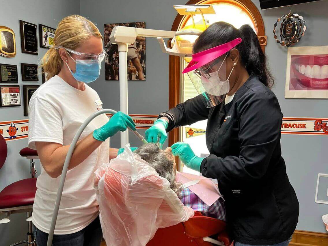 dentist and dental assistant working