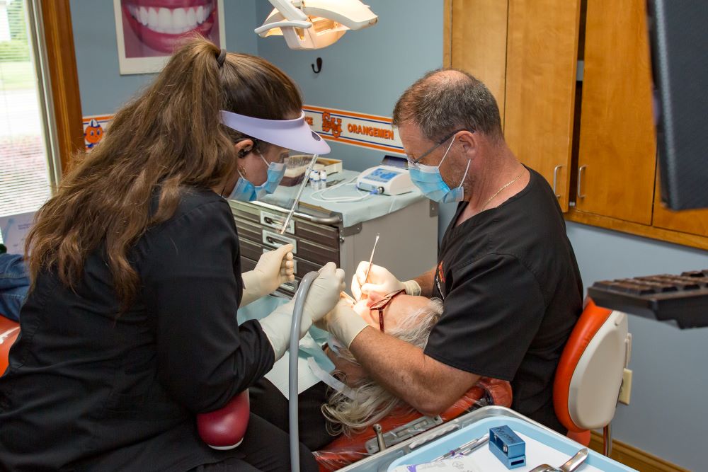 dentist placing implant